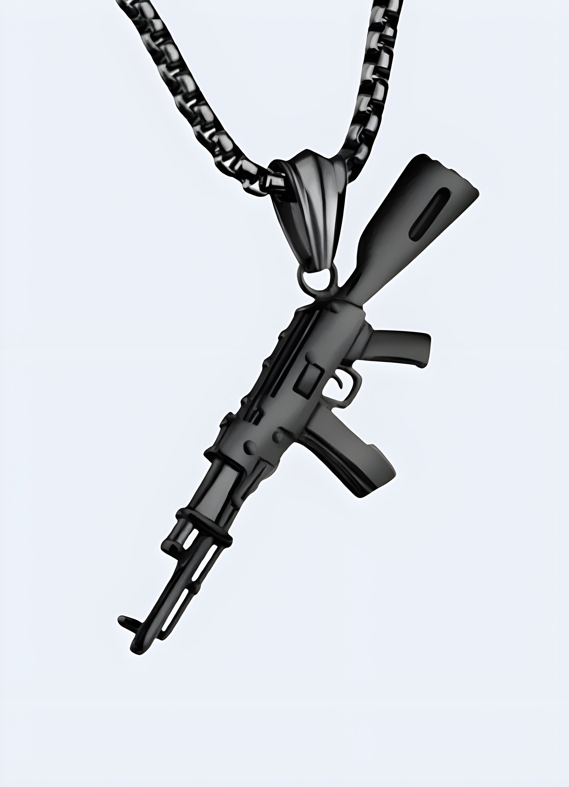 Aggressive AK-47 rifle pendant black oxide coated stainless steel.