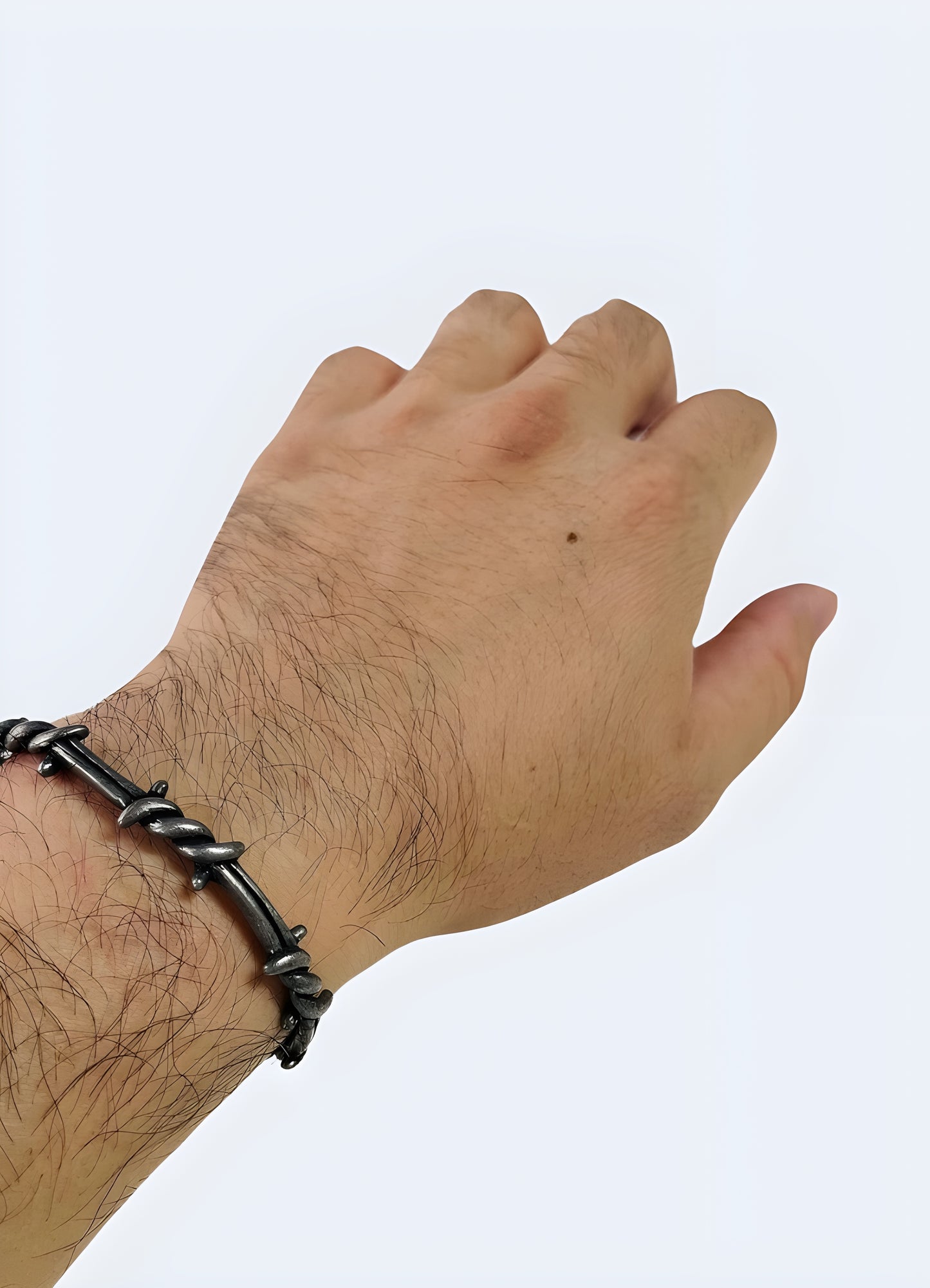 Slip-on open cuff shape barbed wire bangle.