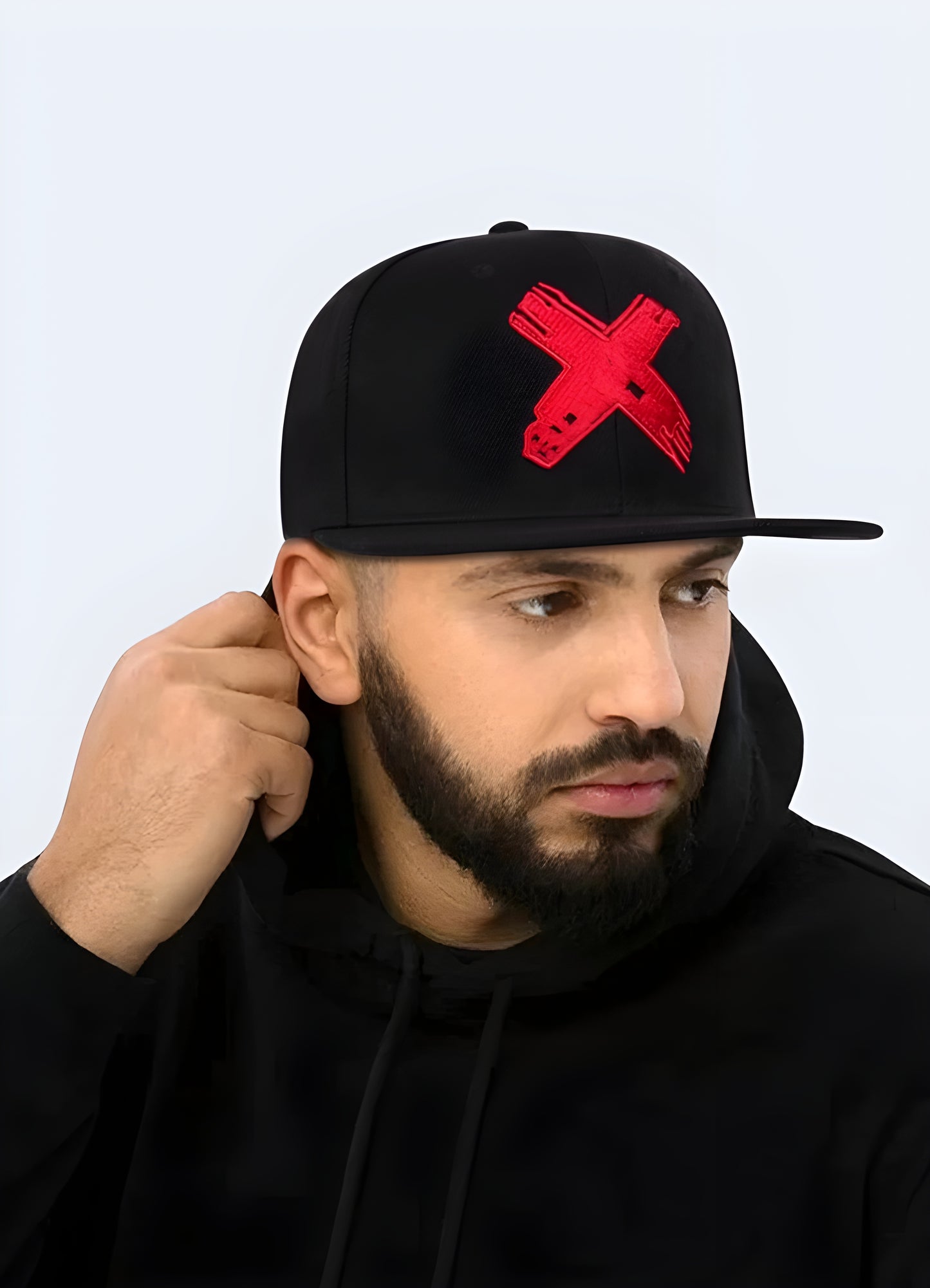 This classic baseball hat features a unique cross logo and curved bill, adding a touch of edge to any outfit.