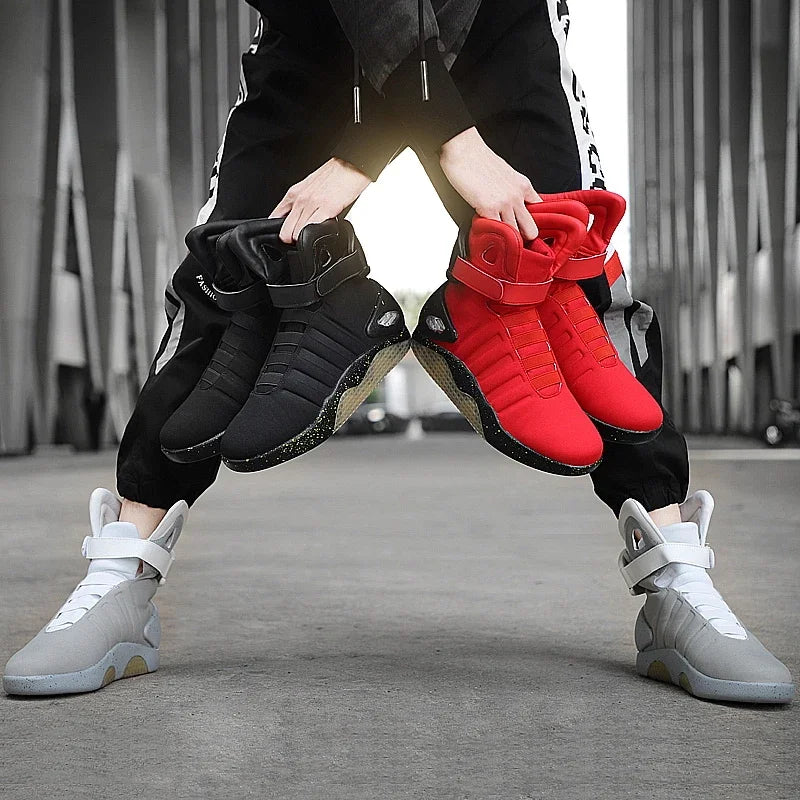 Man wearing futuristic grey shoes. Front and side view of advanced shoe design.