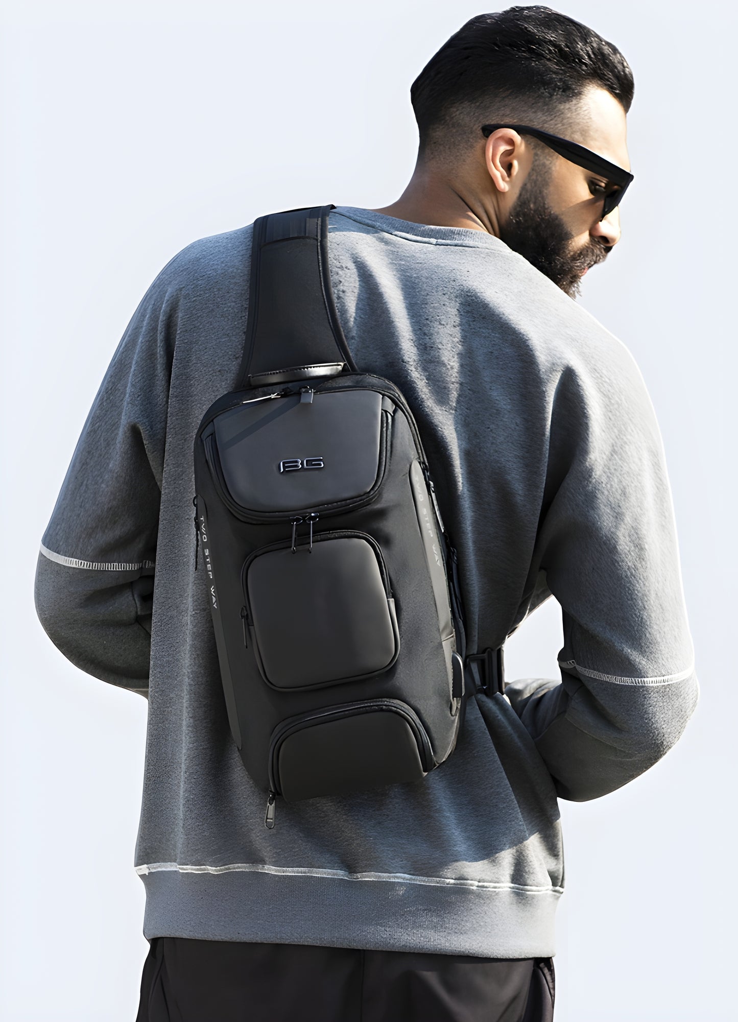 Man wearing a grey sci-fi bag in front view, highlighting the bag's stylish and ergonomic design.