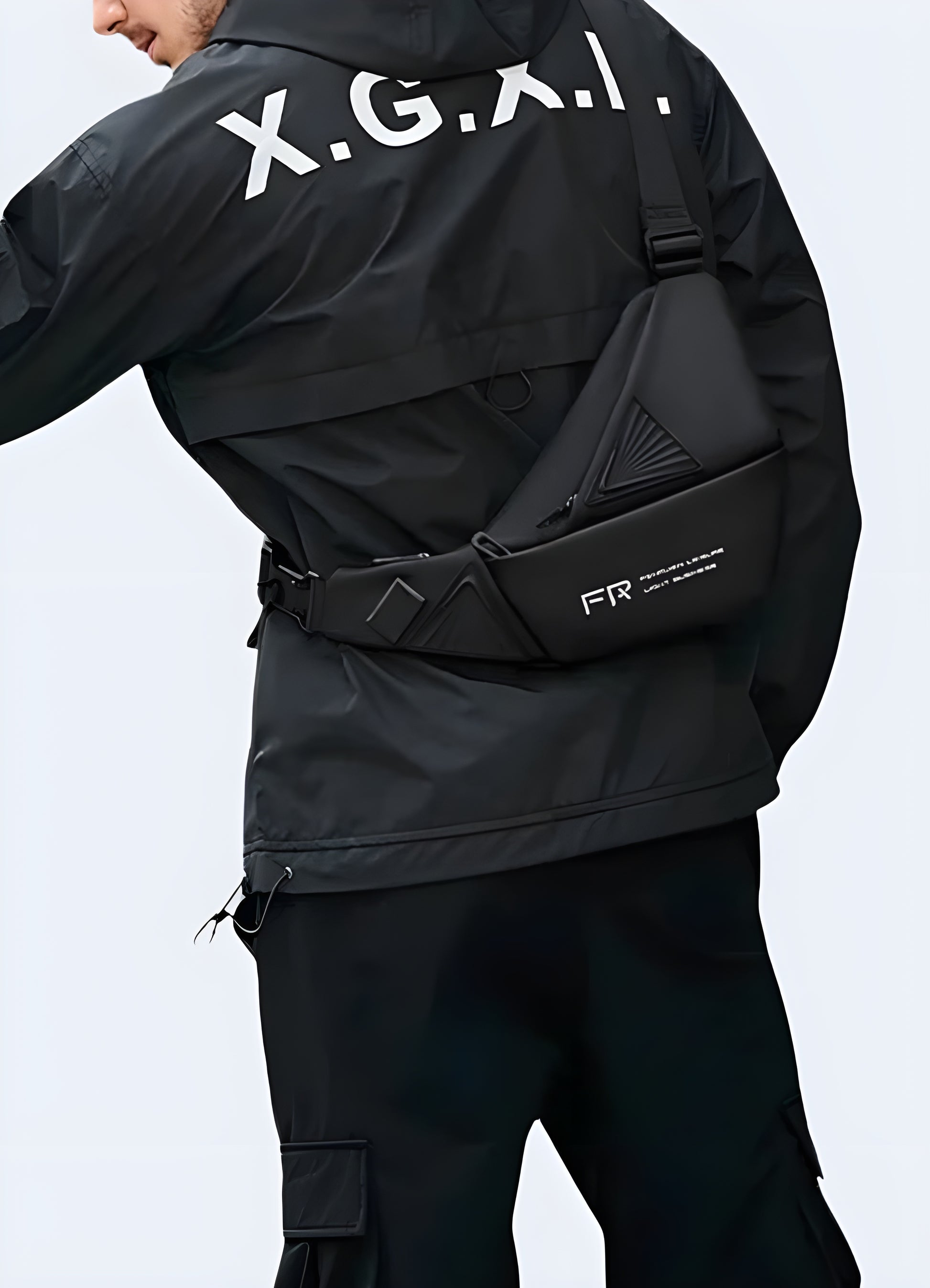 Man wearing a tactical crossbody bag, front side view, highlighting its rugged design.