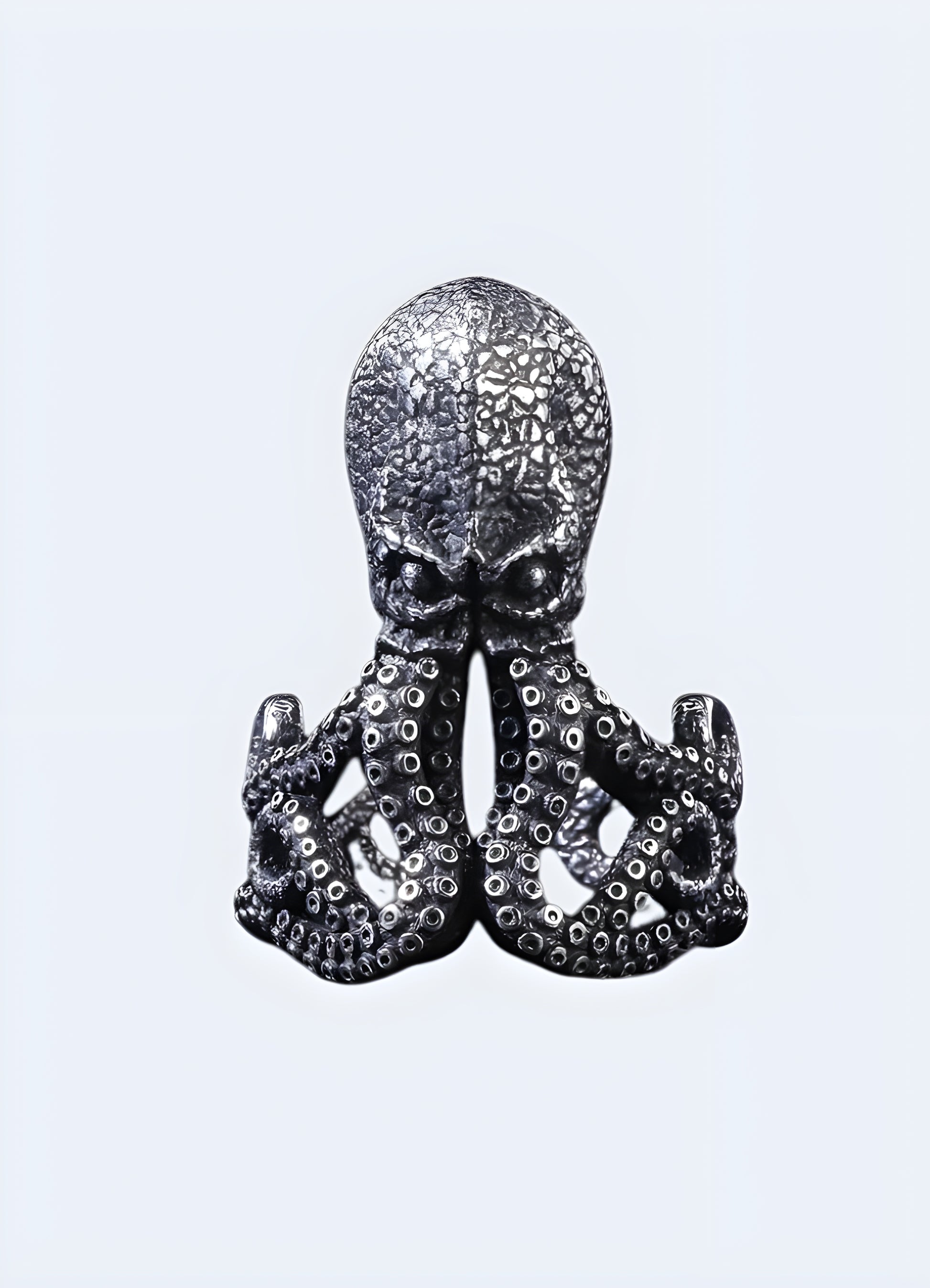 Octopus motif oxidized brass ring.
