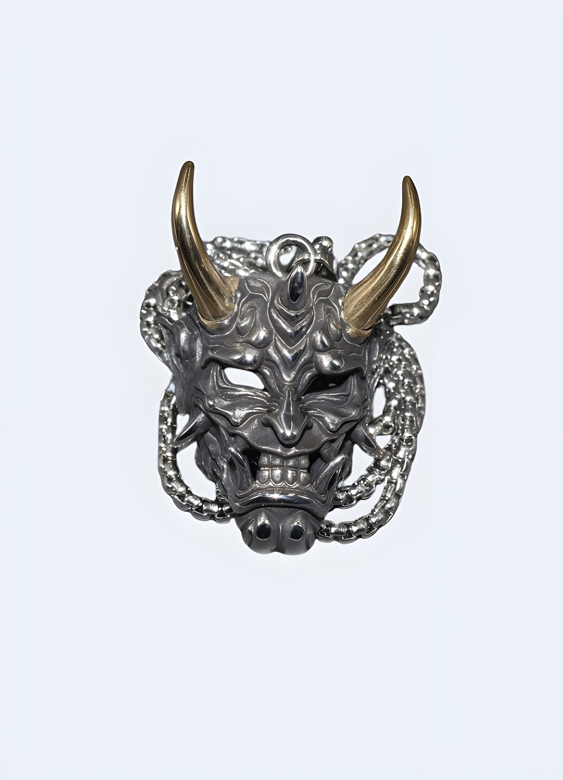 Antique brass metal oni necklace.