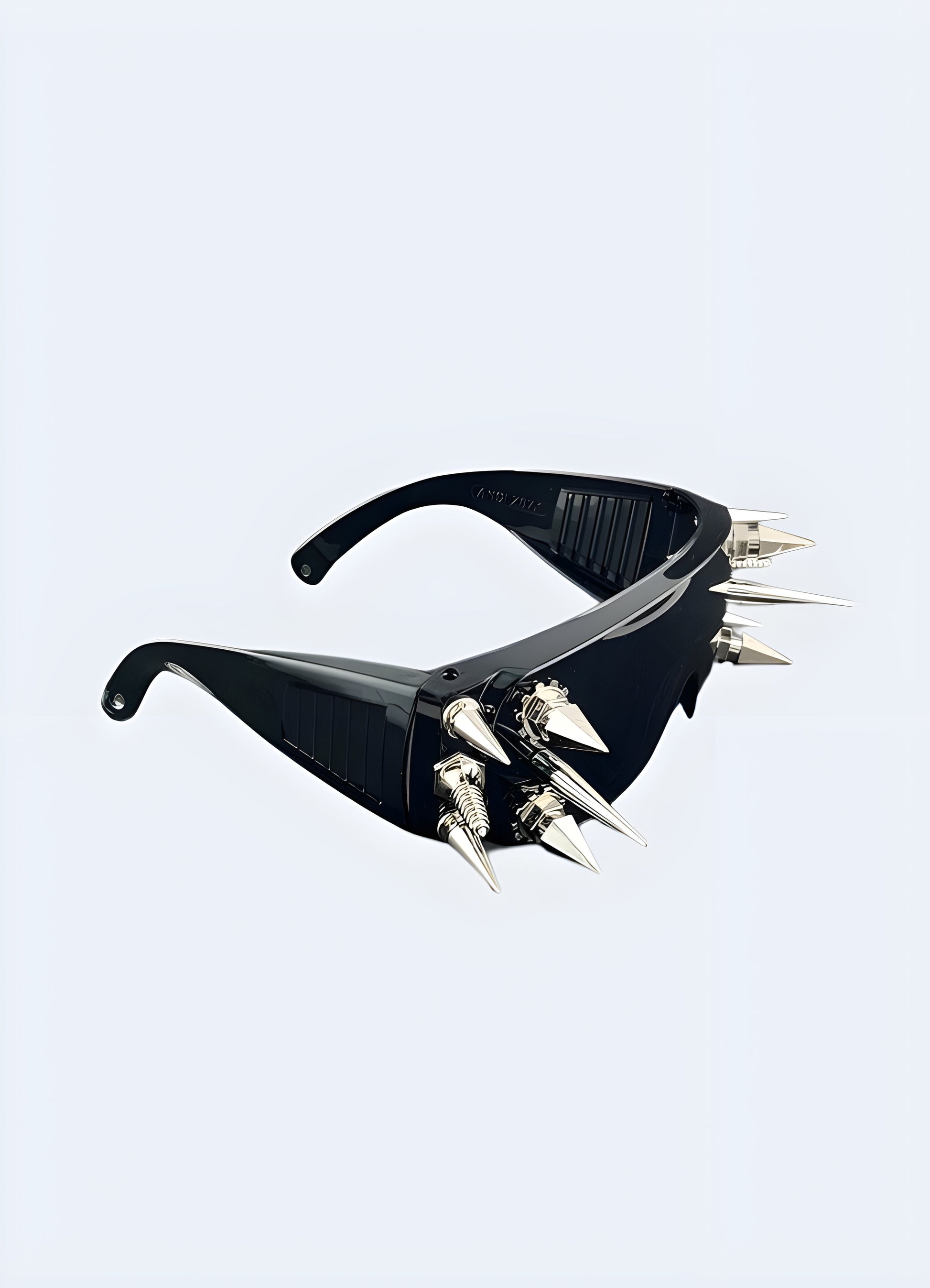 Stand out from the crowd with the intricate rivet and spike details on these sunglasses.