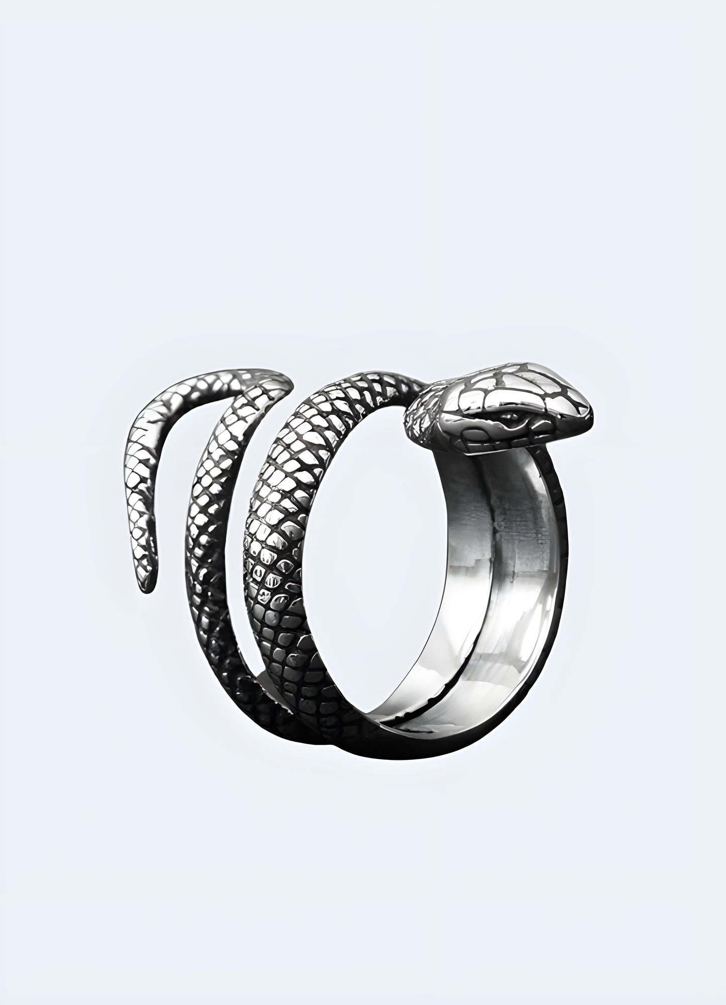 Brushed silver snake coils gracefully around your finger in this charming pinky ring.