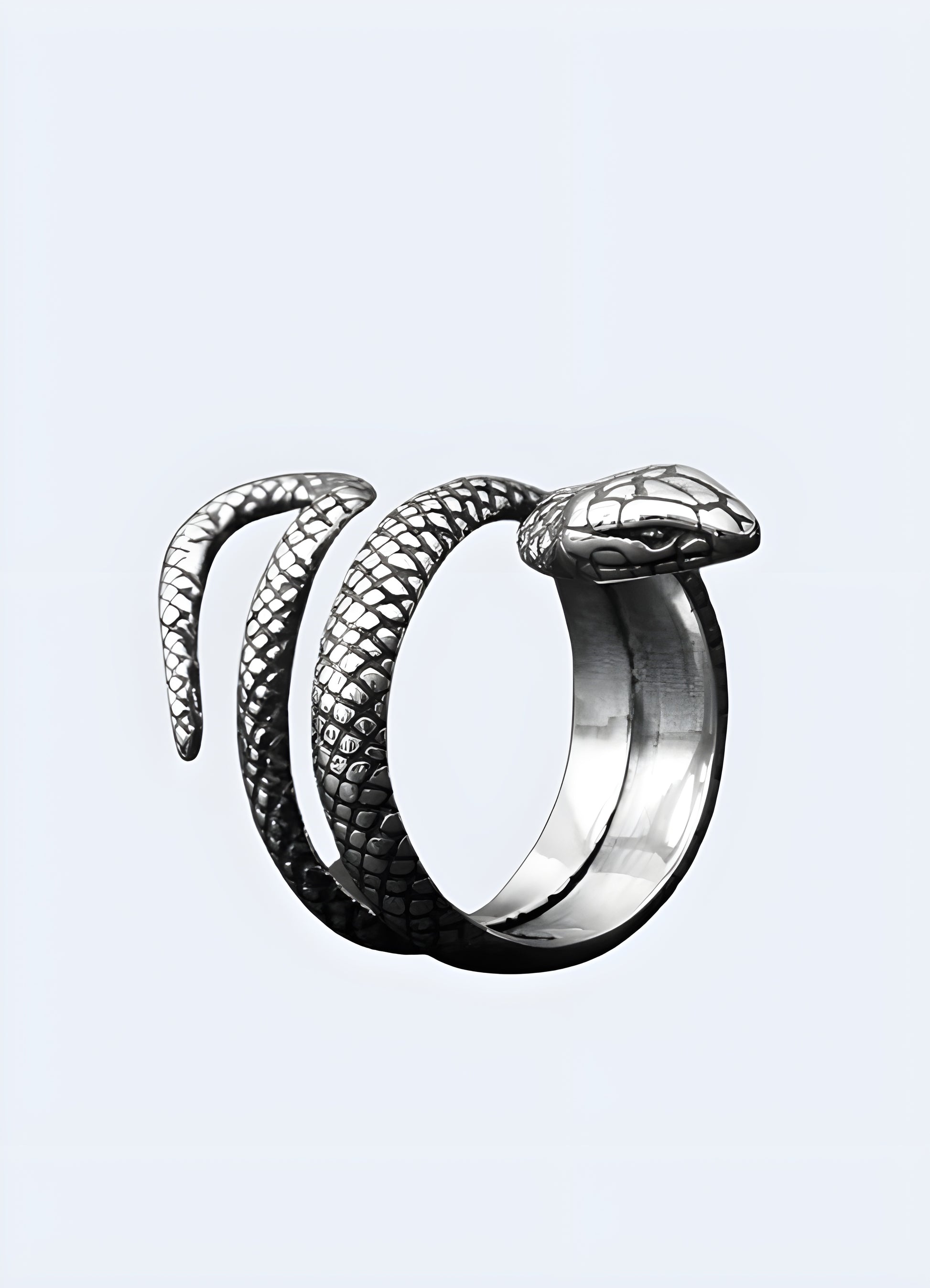 Brushed silver snake coils gracefully around your finger in this charming pinky ring.