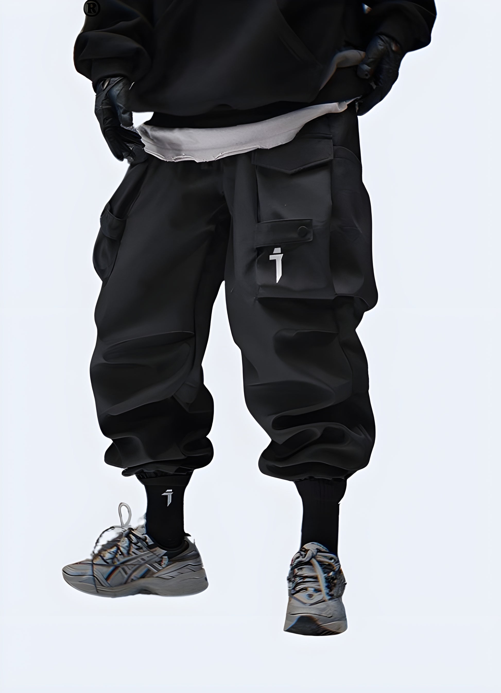 The pants have a slim, tapered fit with multiple utilitarian pockets, including large thigh pockets with zippers and smaller compartments.