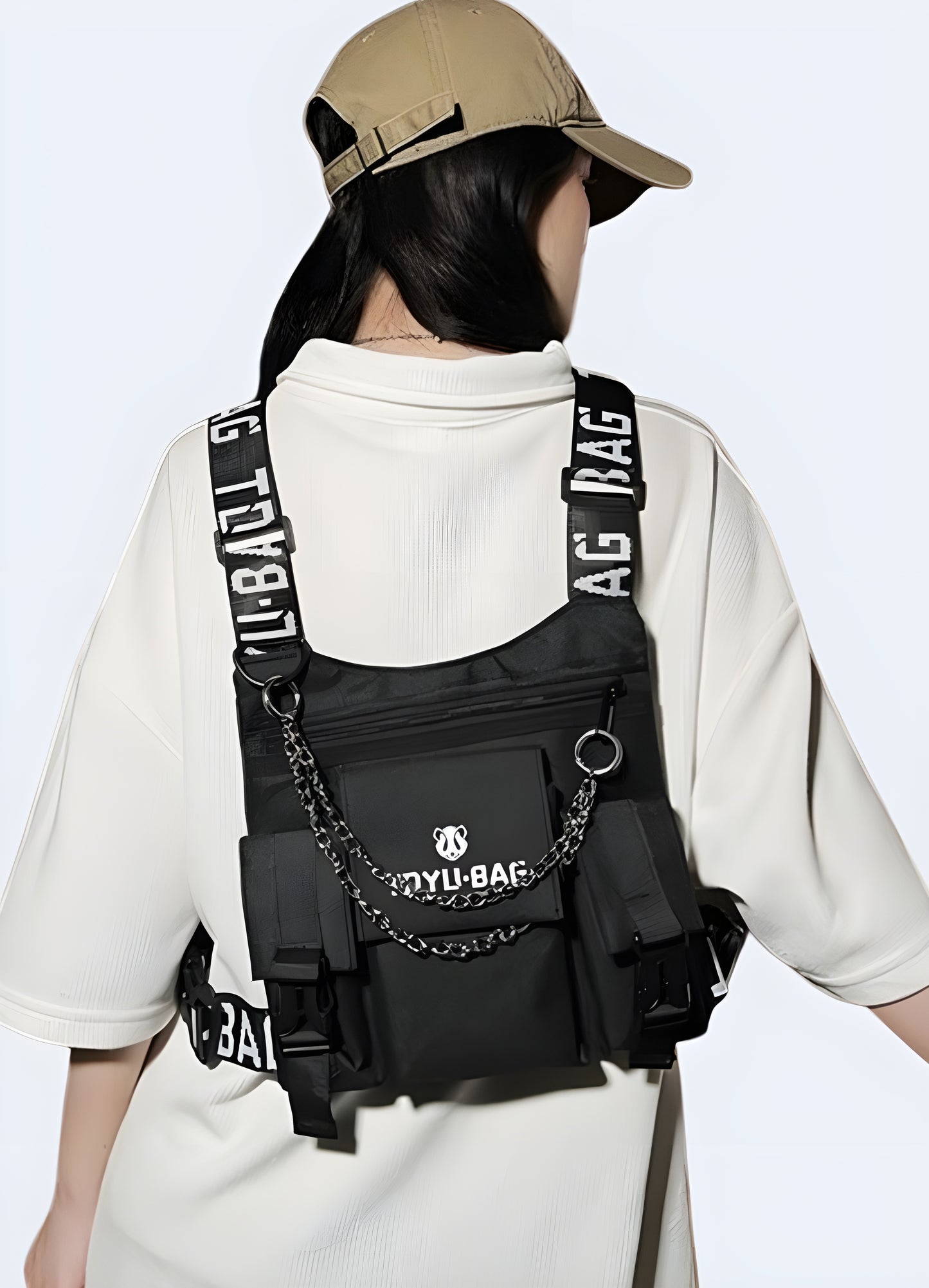 Techwear chest bag secure flap and drawstring closure.