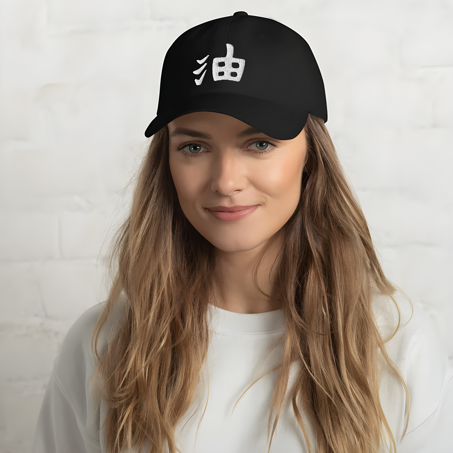 A model wearing a black cap with kanji characters, shown from the side to highlight the cap’s design and the bold, cultural statement made by the kanji in the overall look.