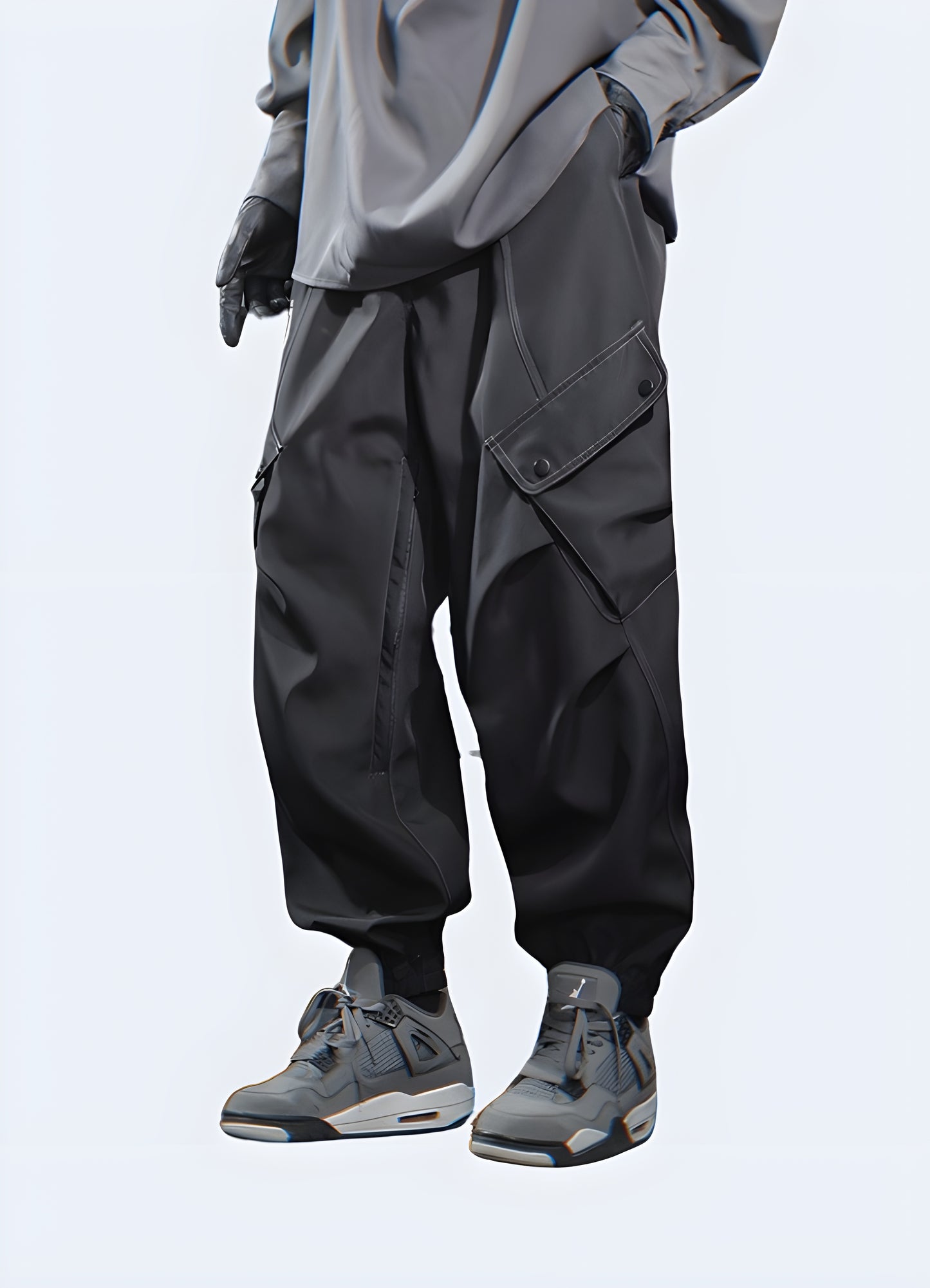 Dark grey cargo pants, side view, worn by model, urban techwear fashion.