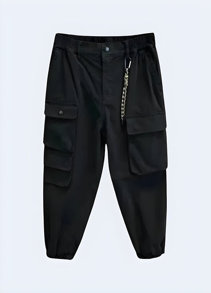 The pants have a slim, tapered fit and a matte black finish, highlighting their modern and futuristic aesthetic.