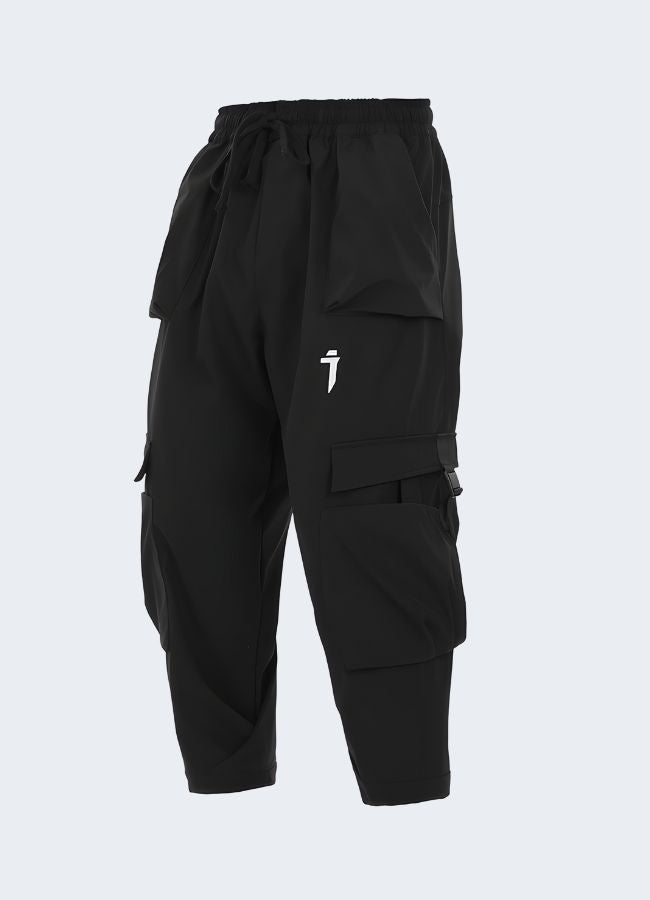 The pants have a slim, tapered fit and a matte black finish, highlighting their modern and futuristic aesthetic. 