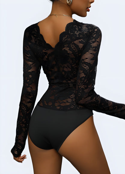 Deep-v fishnet bodysuit with harness straps.