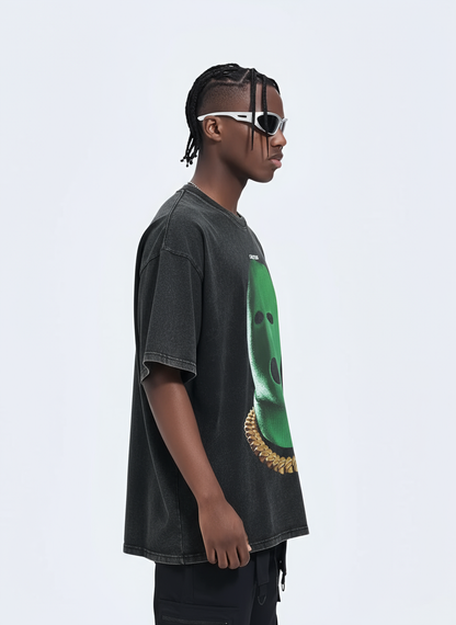 Person wearing a dark gray t-shirt with a green graphic design on a light gray background