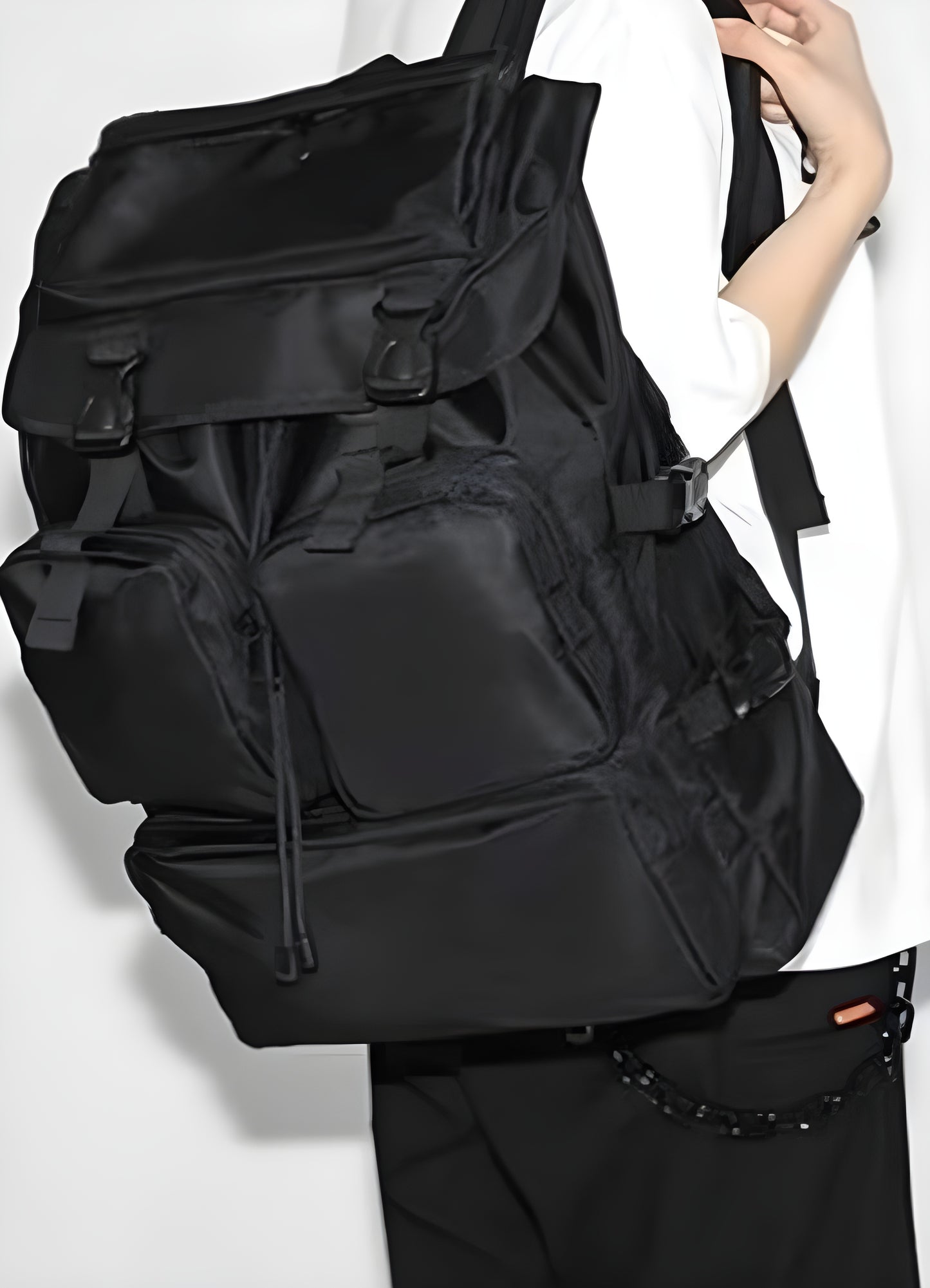 Back view of a black Japanese streetwear backpack featuring durable construction and ergonomic straps.
