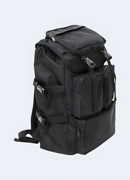 Front view of a black Japanese streetwear backpack featuring minimalist design and premium materials.