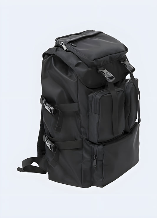 Front view of a black Japanese streetwear backpack featuring minimalist design and premium materials.