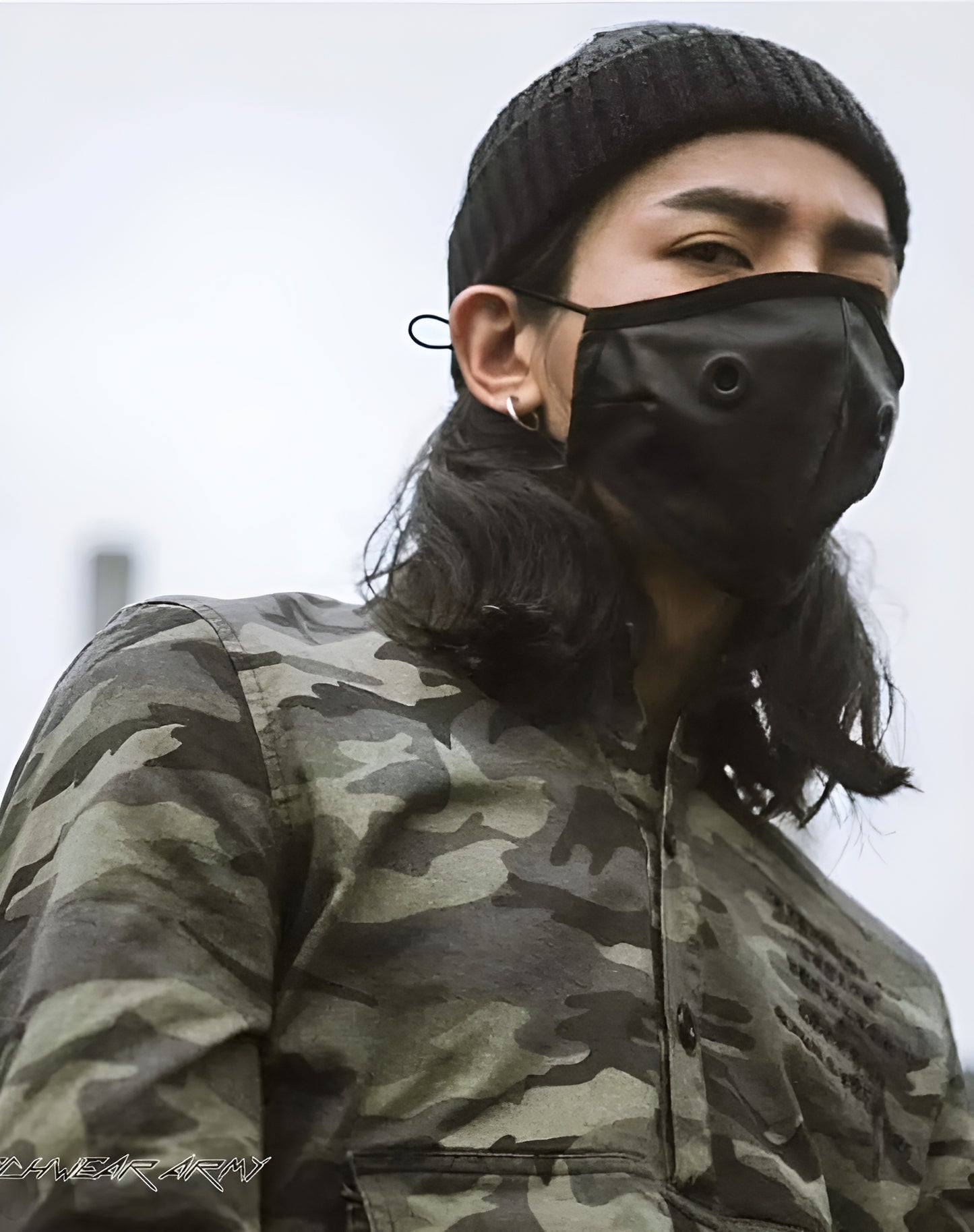 Front view of a person wearing a leather half face mask, covering the lower half of the face.