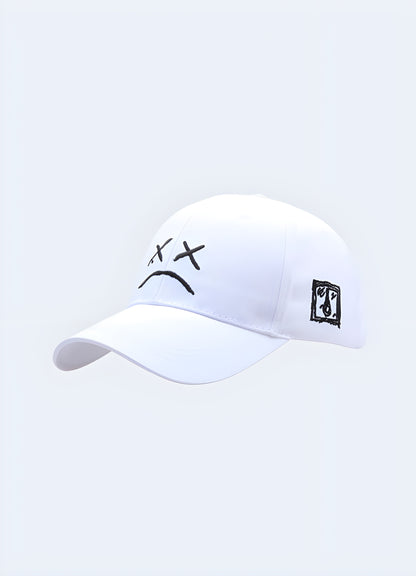 Inscribed with a poignant sad smiley face, the emblem of lil peep cap white.
