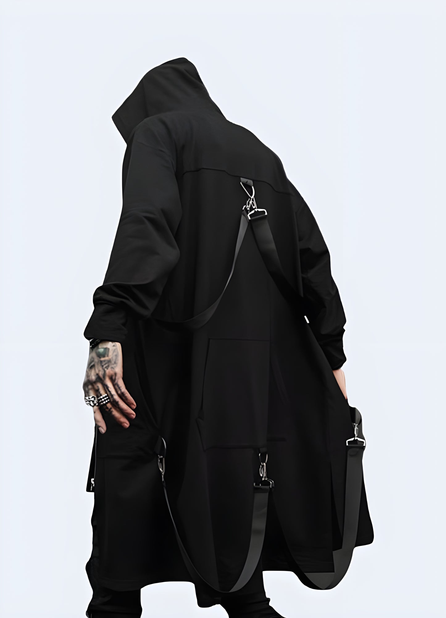 The long black straps attached by buckles at the shoulders futuristic cloak. 