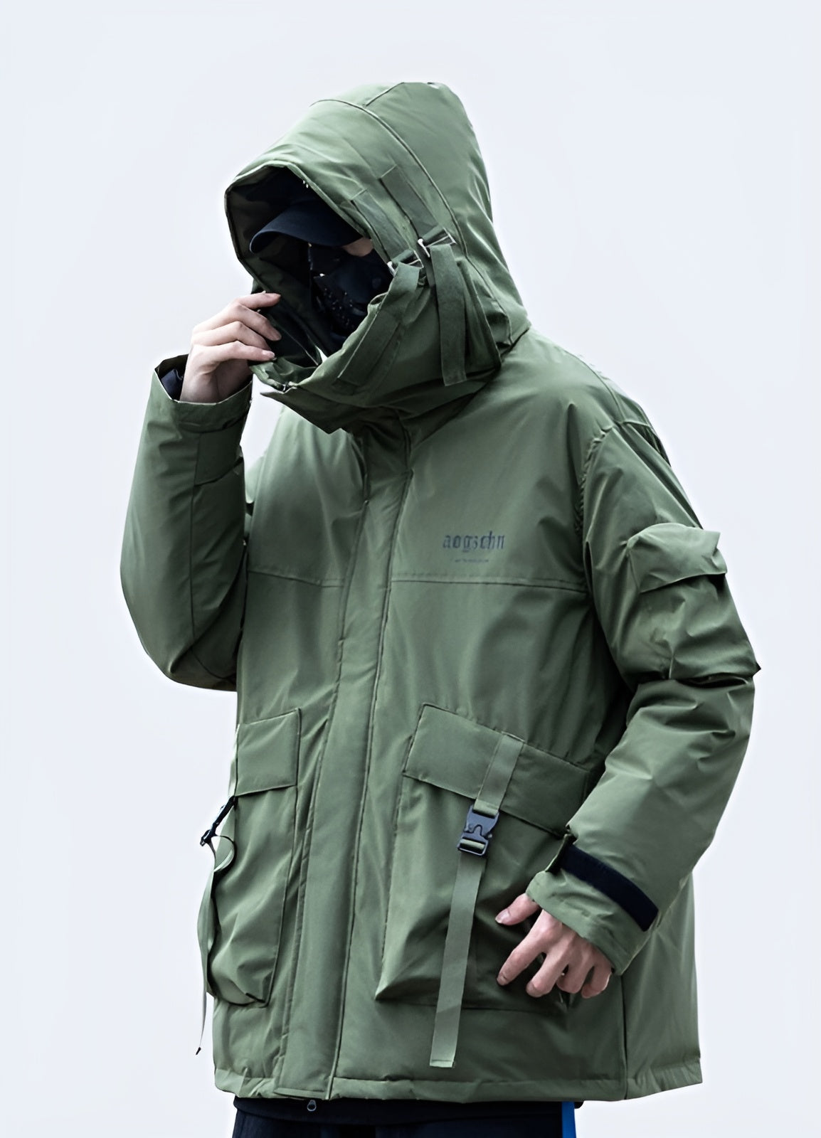 Back view of a man wearing a green techwear jacket, highlighting its sleek silhouette and advanced materials, ideal for active individuals in the AU.