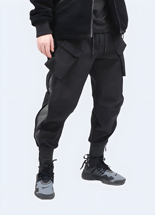 Minimalist technical pants black front side view.