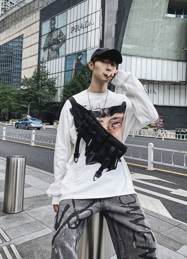 Front view of a man with a tactical bumbag, emphasizing its practicality and style.