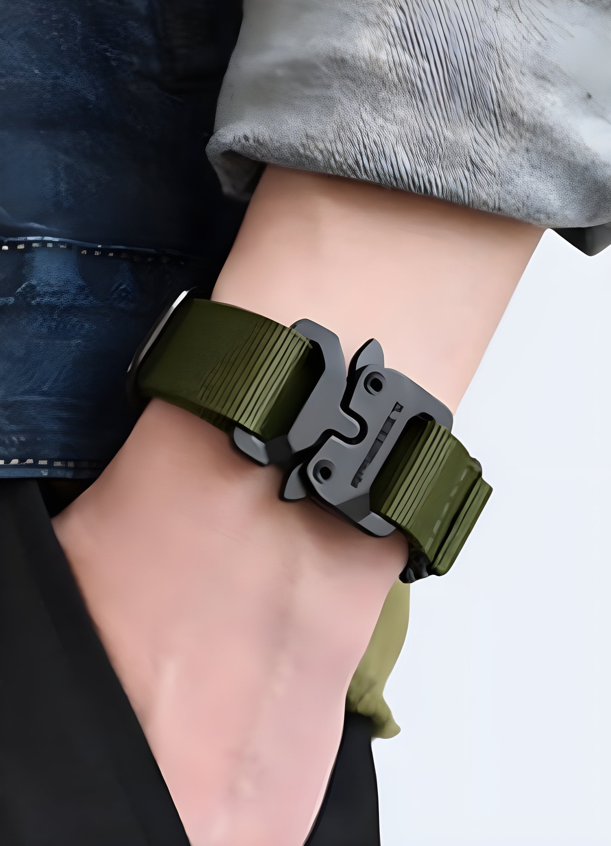 Crafted from sleek stainless steel, this techwear bracelet boasts a wide, modern cuff.