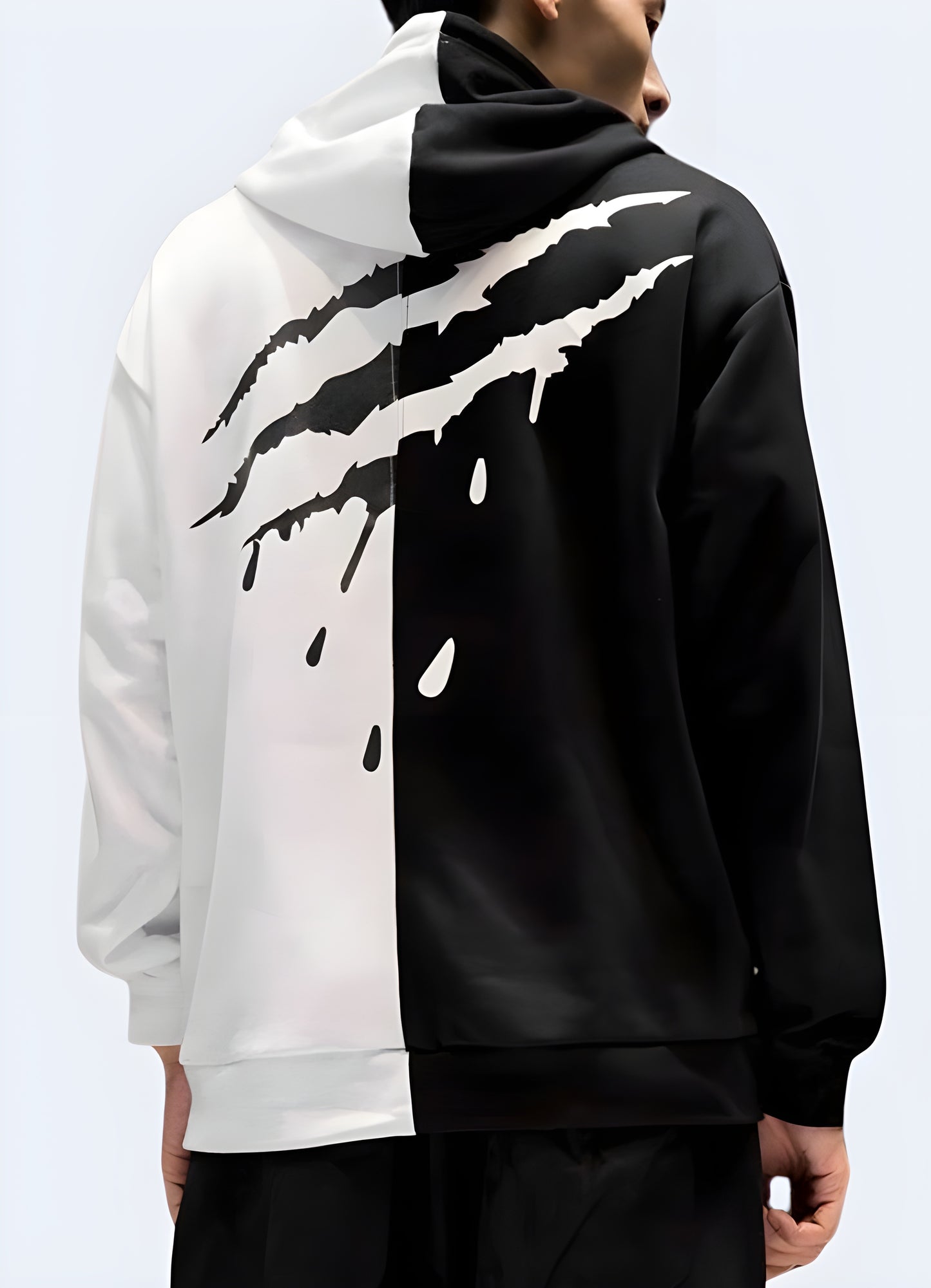 Channel your inner rockstar in this edgy white and black split hoodie.