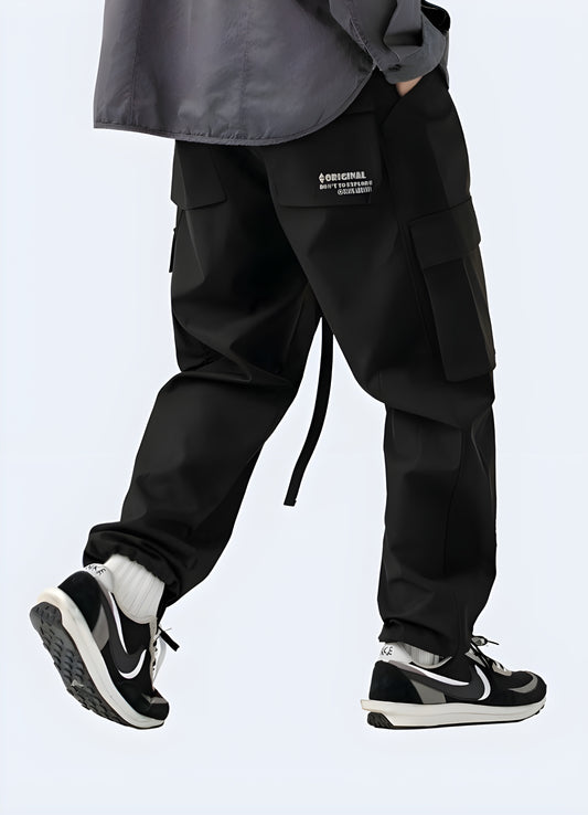 Classic men wearing black cargo pants design with multiple pockets.