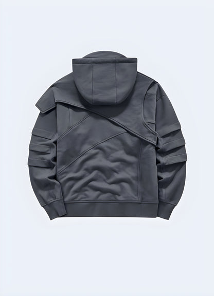 Man wearing a black tech fleece hoodie, back view. This stylish hoodie features a sleek, modern design with high-performance fabric for warmth and comfort. Ideal for urban and techwear fashion, it offers a futuristic aesthetic with a streamlined fit.