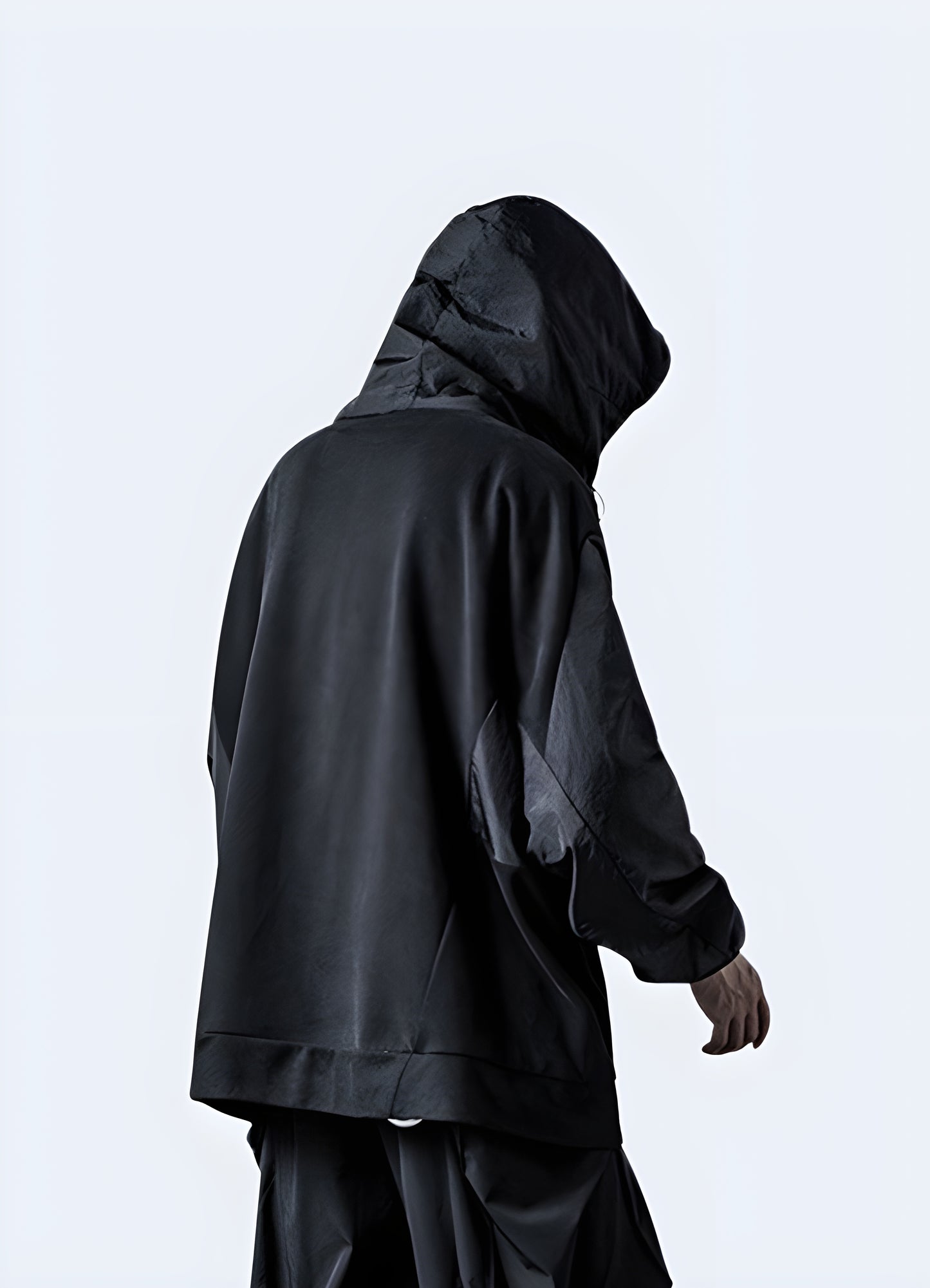 The hoodie presents an exquisite dual-tone, subtly juxtaposing matte black and light black.