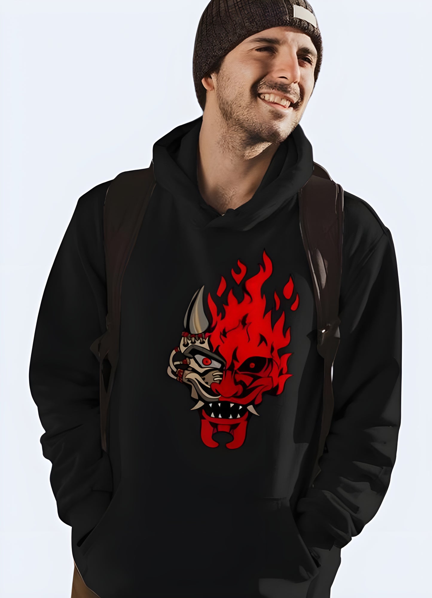 Blaze into winter with this bold black sweatshirt featuring a ferocious red oni graphic. 