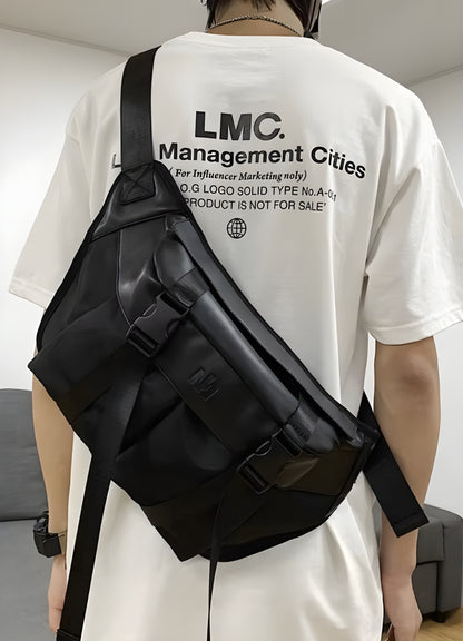 Man wearing a sling bag with streetwear, side view, highlighting trendy urban fashion. Perfect for a stylish and practical look.