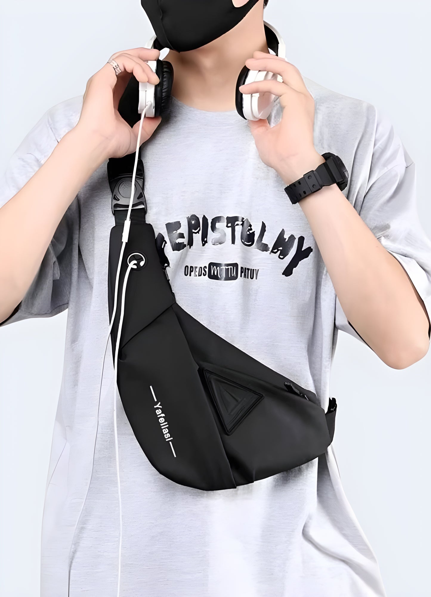 Man wearing a tactical crossbody bag, front side view, highlighting its rugged design.