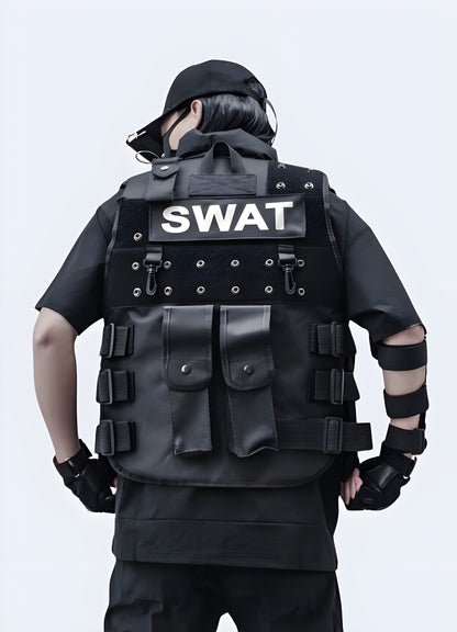 Men wearing black tactical vest swat back view.