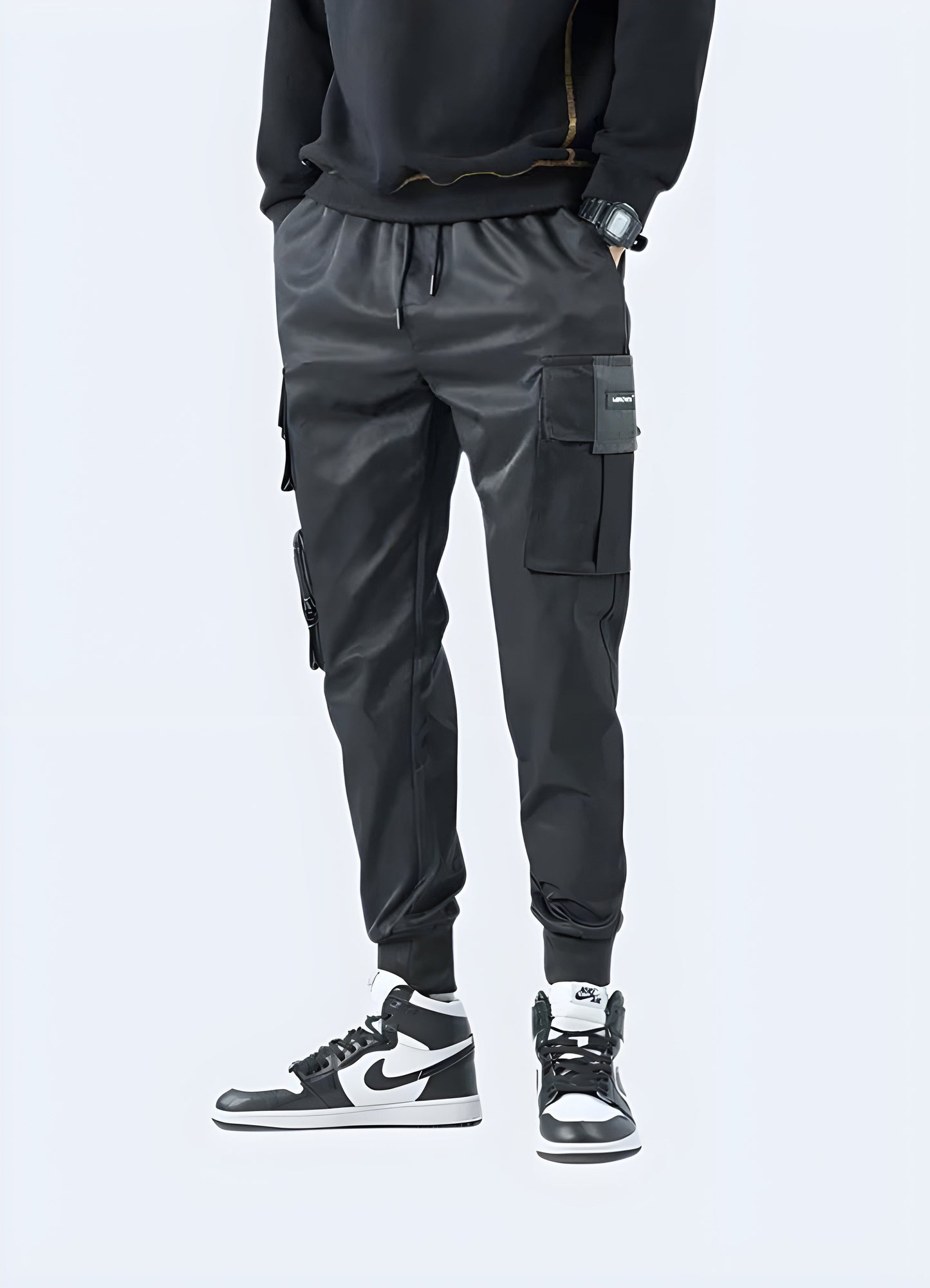 Smooth and stretchy black fabric technical joggers pants.