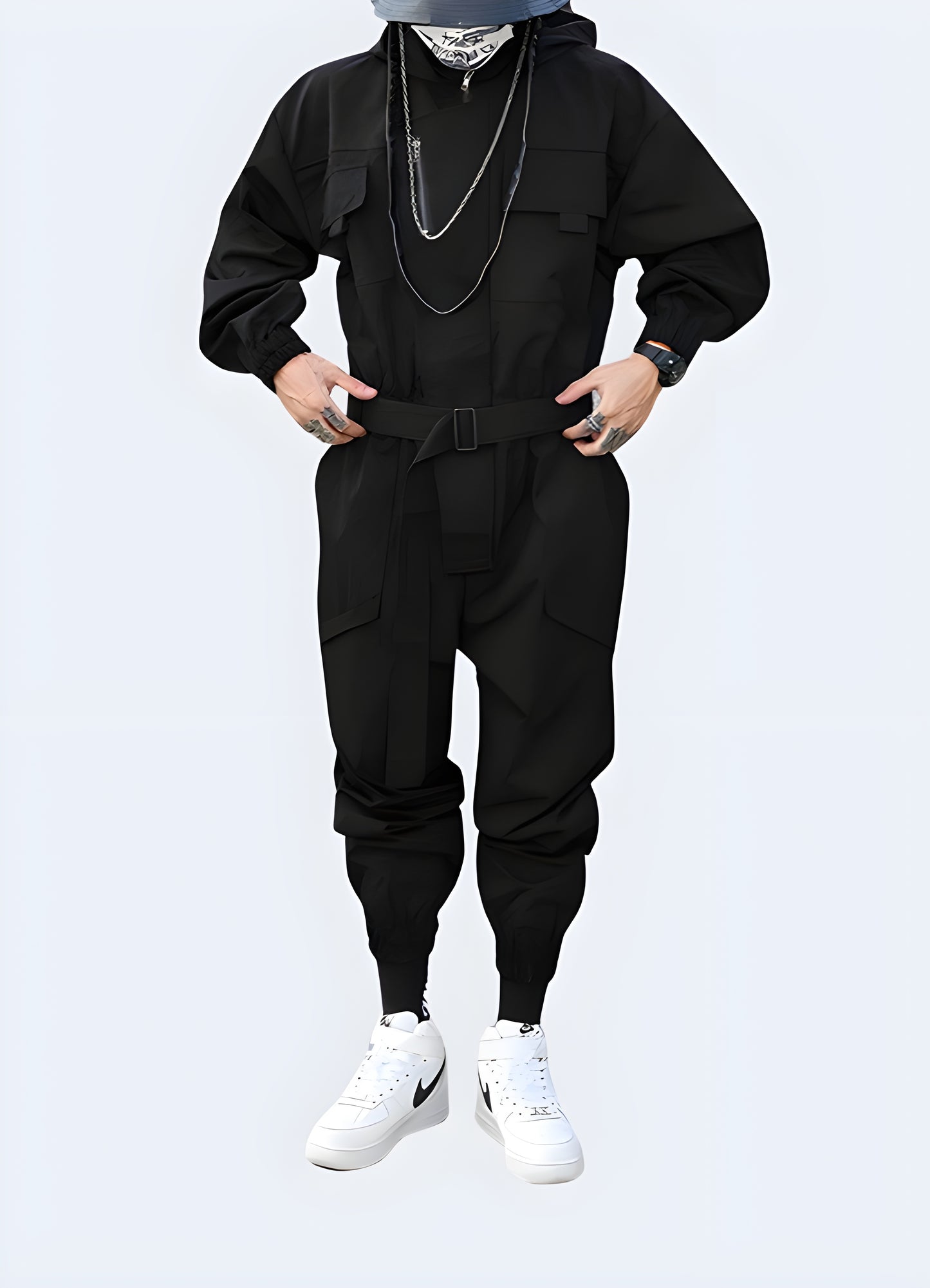 Techwear jumpsuit features multiple chest, thigh, and buttock cargo pockets.