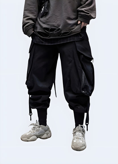 Men wearing techwear black pant side view.