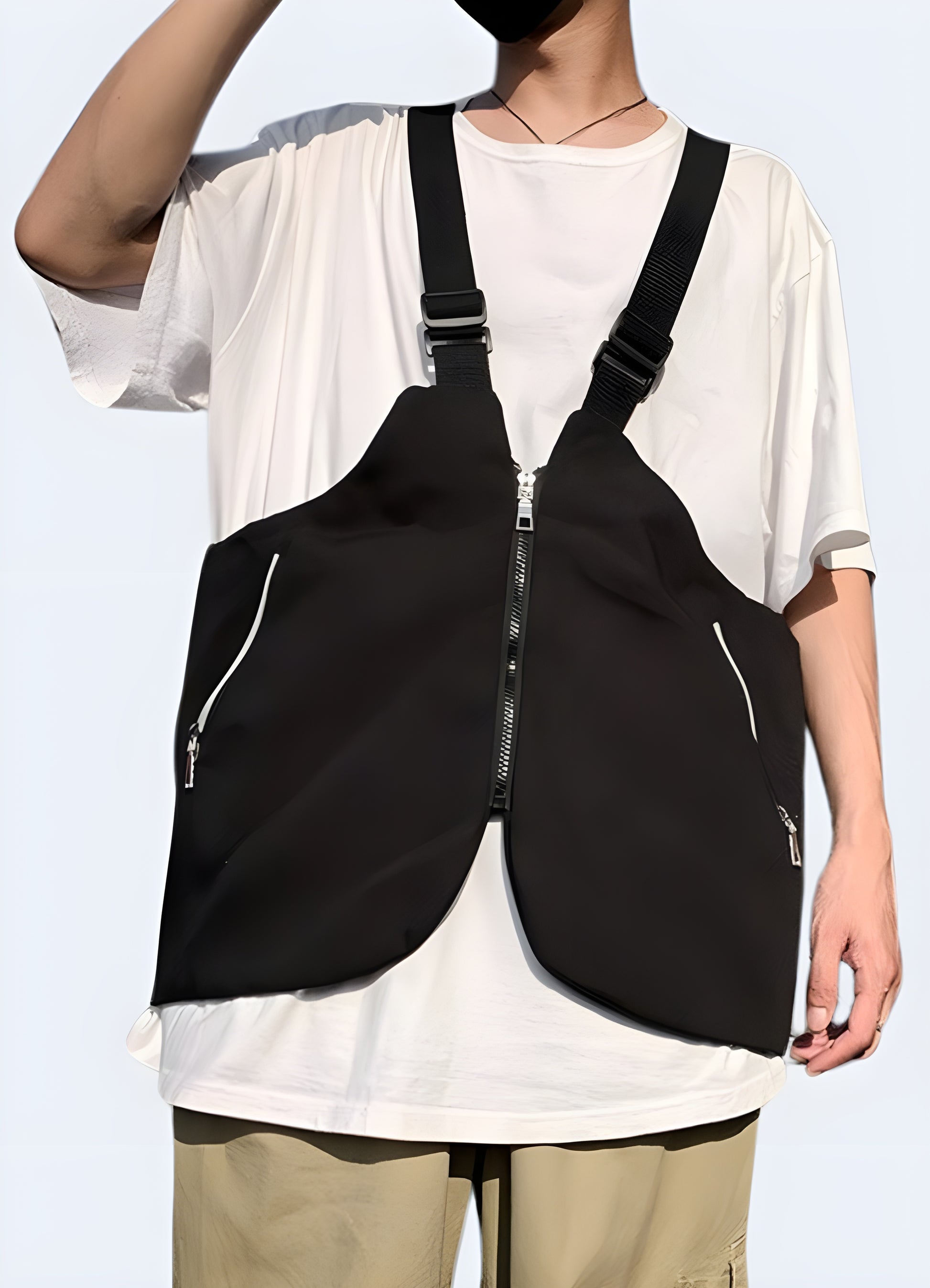 The vest integrates a functional chest bag design, offering multiple compartments and adjustable straps for practical use. 