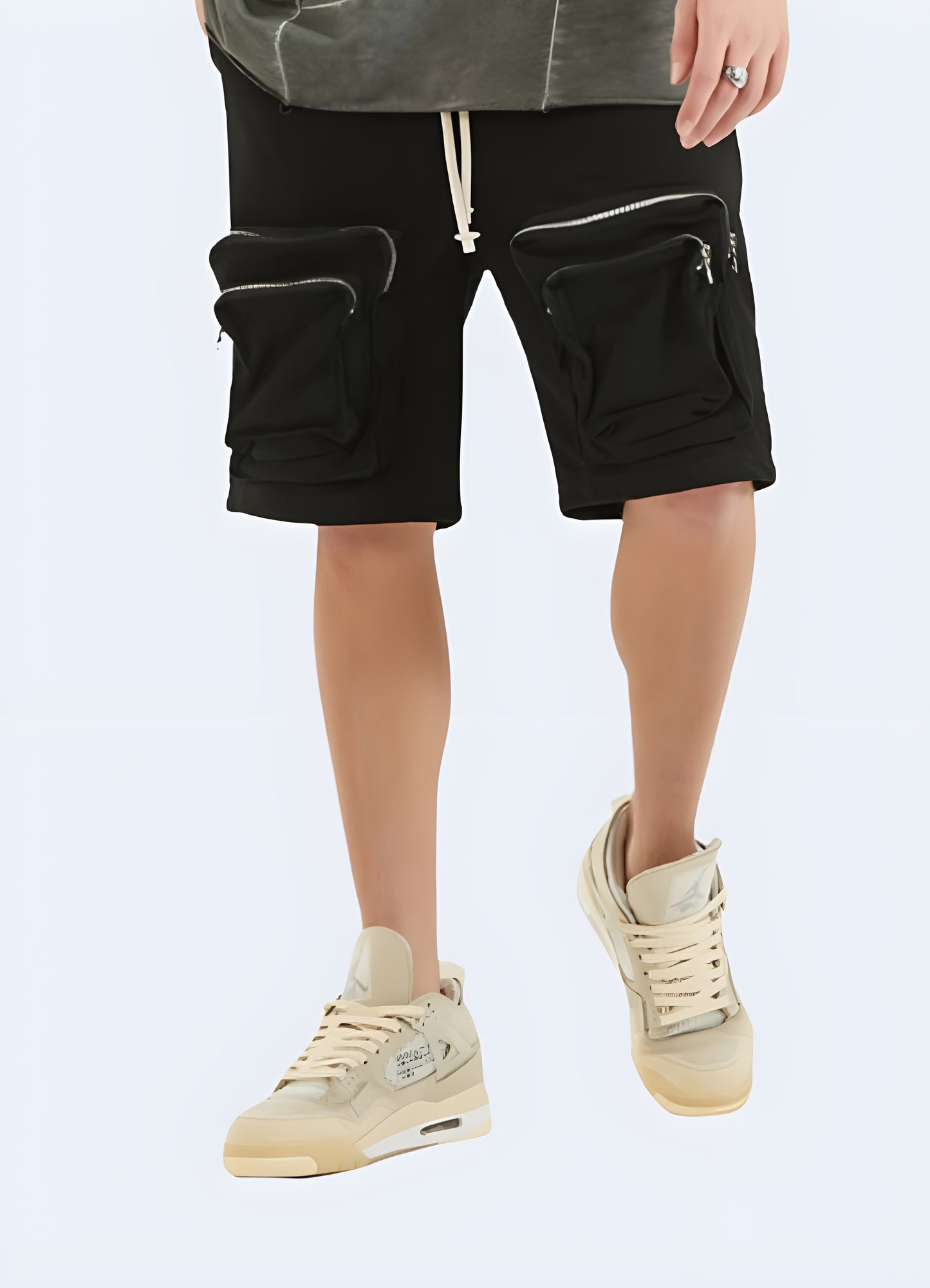 Drawstring closure elastic waist zipper cargo shorts.