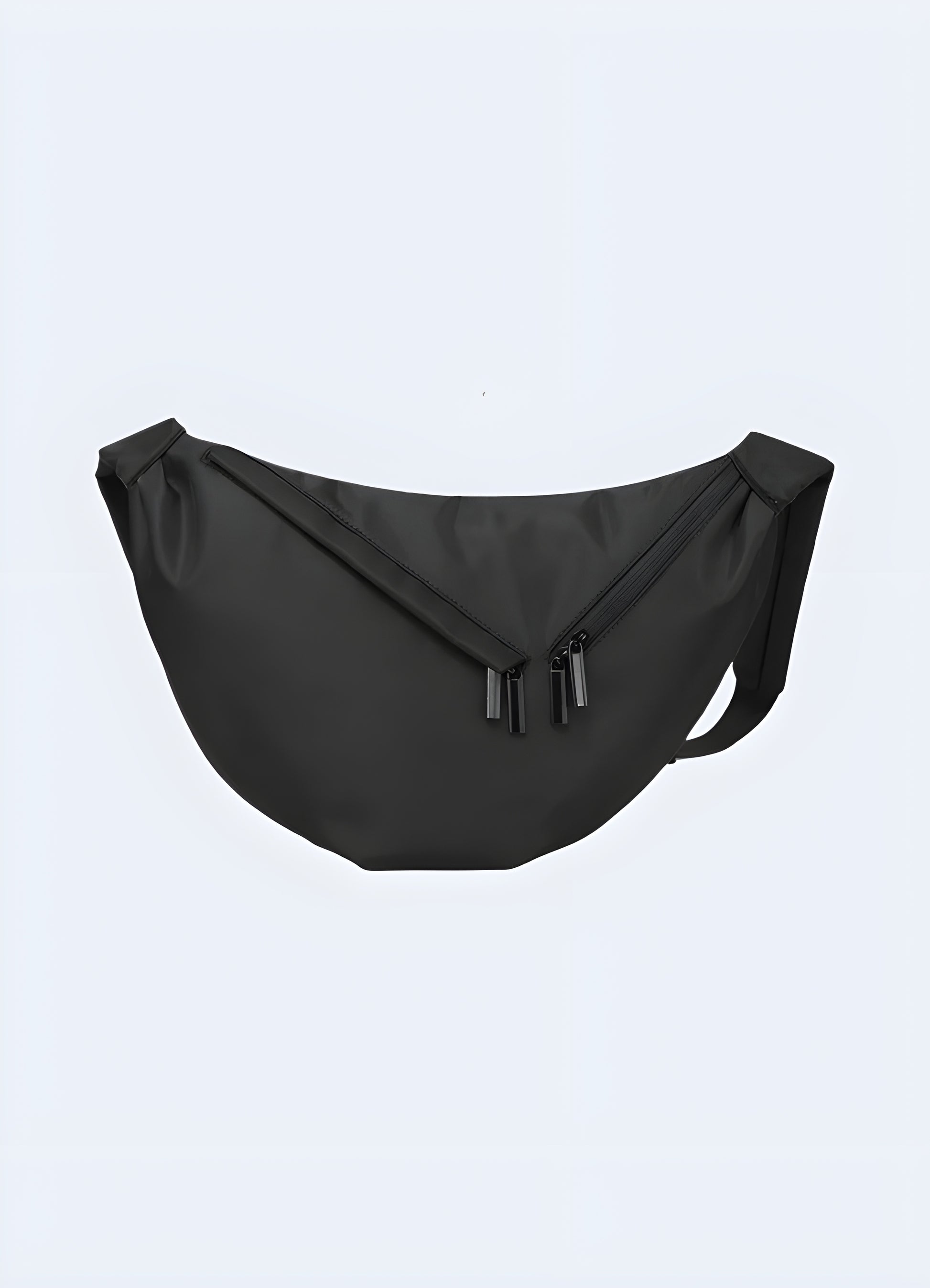 Male model wearing black urban sling bag – front view showcasing techwear-style crossbody chest bag with multiple secure pockets and adjustable strap, perfect for city wear and travel.