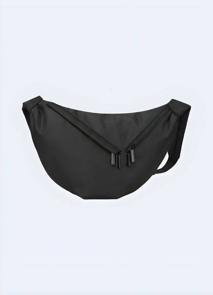 Male model wearing black urban sling bag – front view showcasing techwear-style crossbody chest bag with multiple secure pockets and adjustable strap, perfect for city wear and travel.