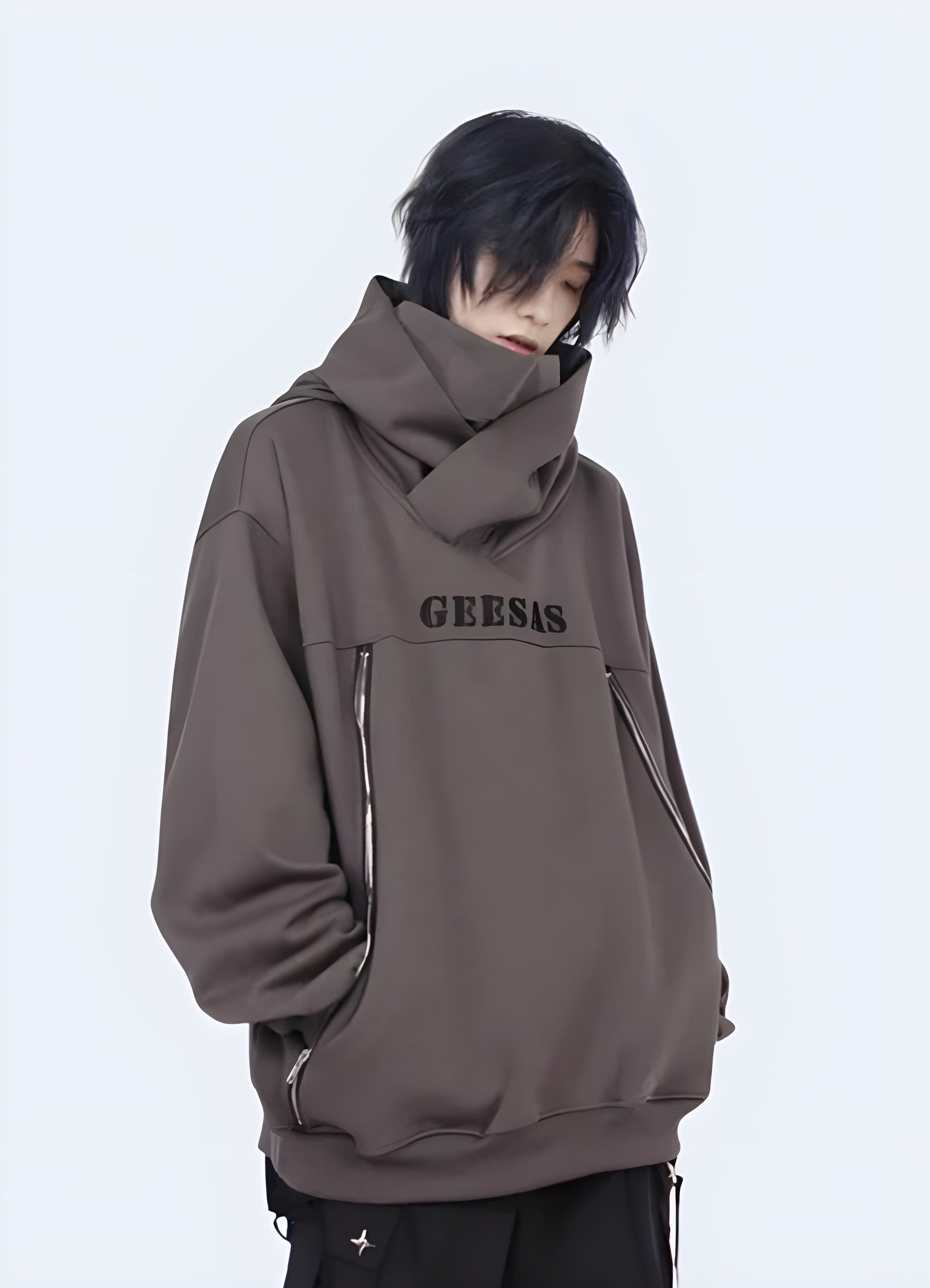 Wearing an oversized grey zip-up hoodie in a front view, showcasing a comfortable and casual streetwear style popular in the AU.