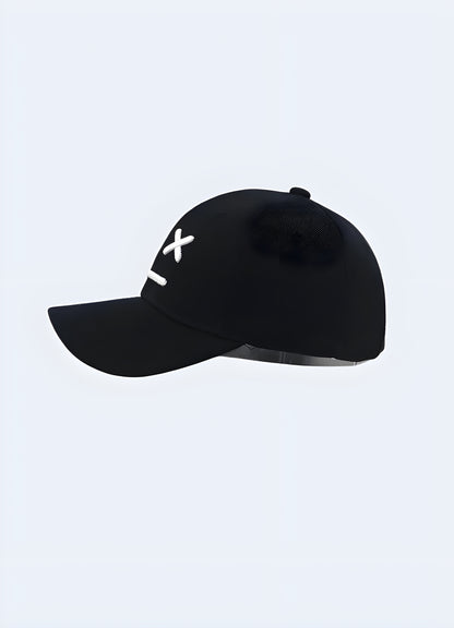 Side view of a black Sad Boy hat. The hat features a minimalist design with a small logo or embroidery on the side. 