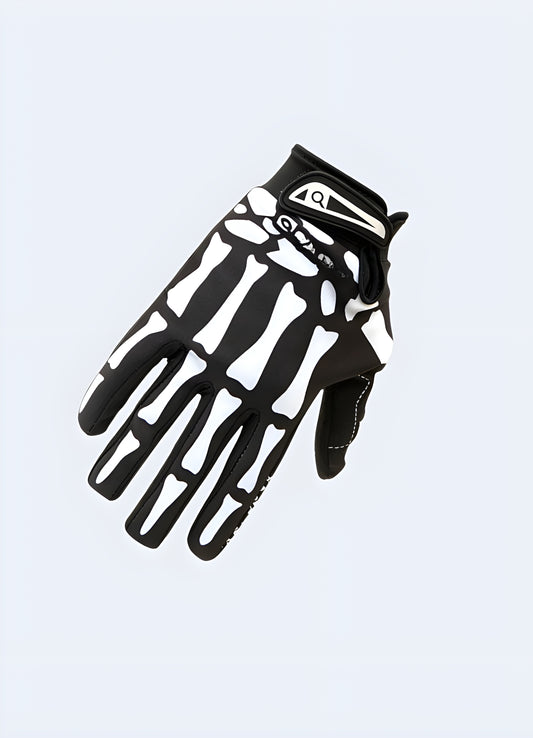 A pair of black tactical gloves featuring a skull design on the back of the hands.