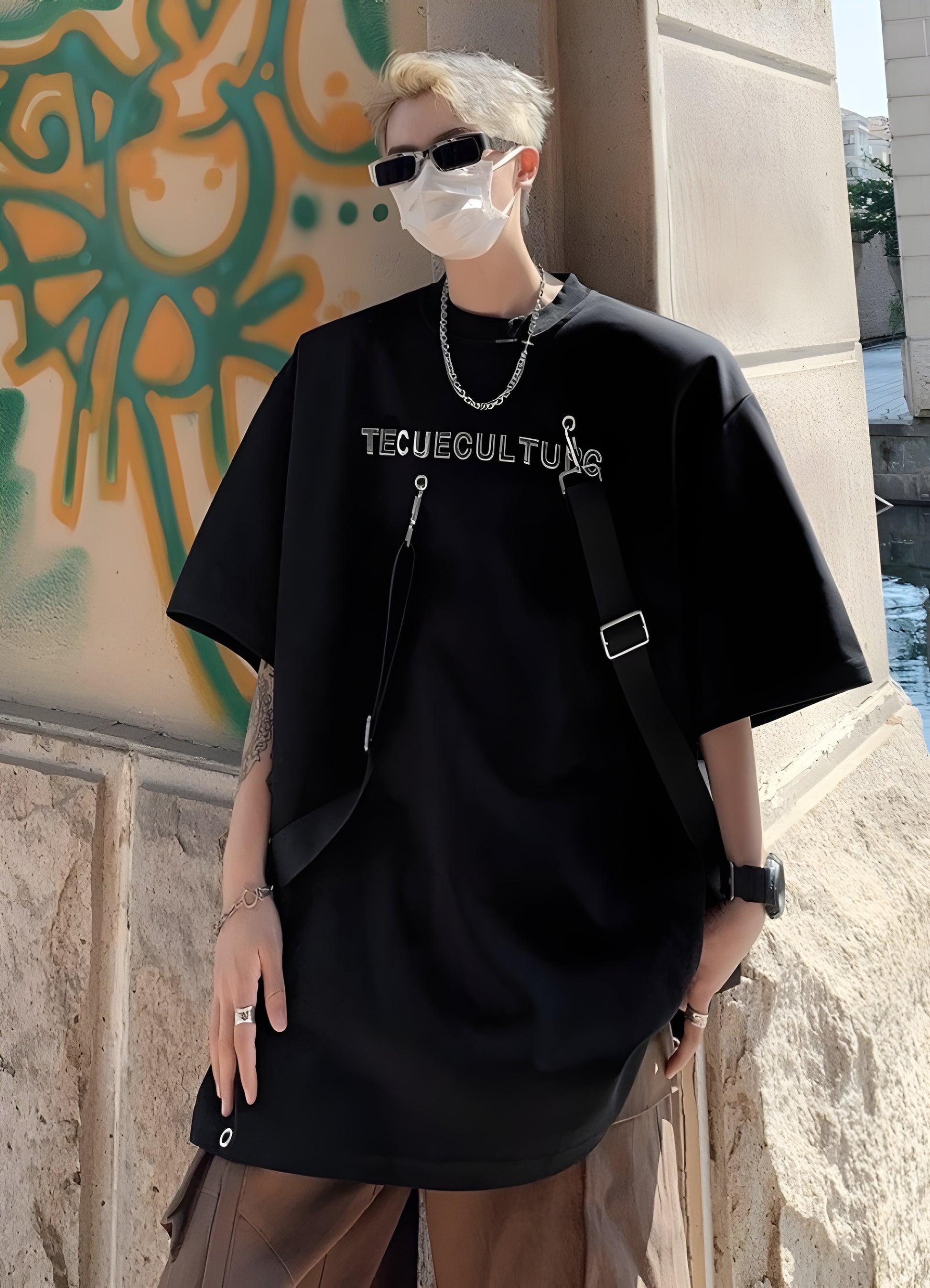 Short sleeve tee with strap details standard unisex fit.