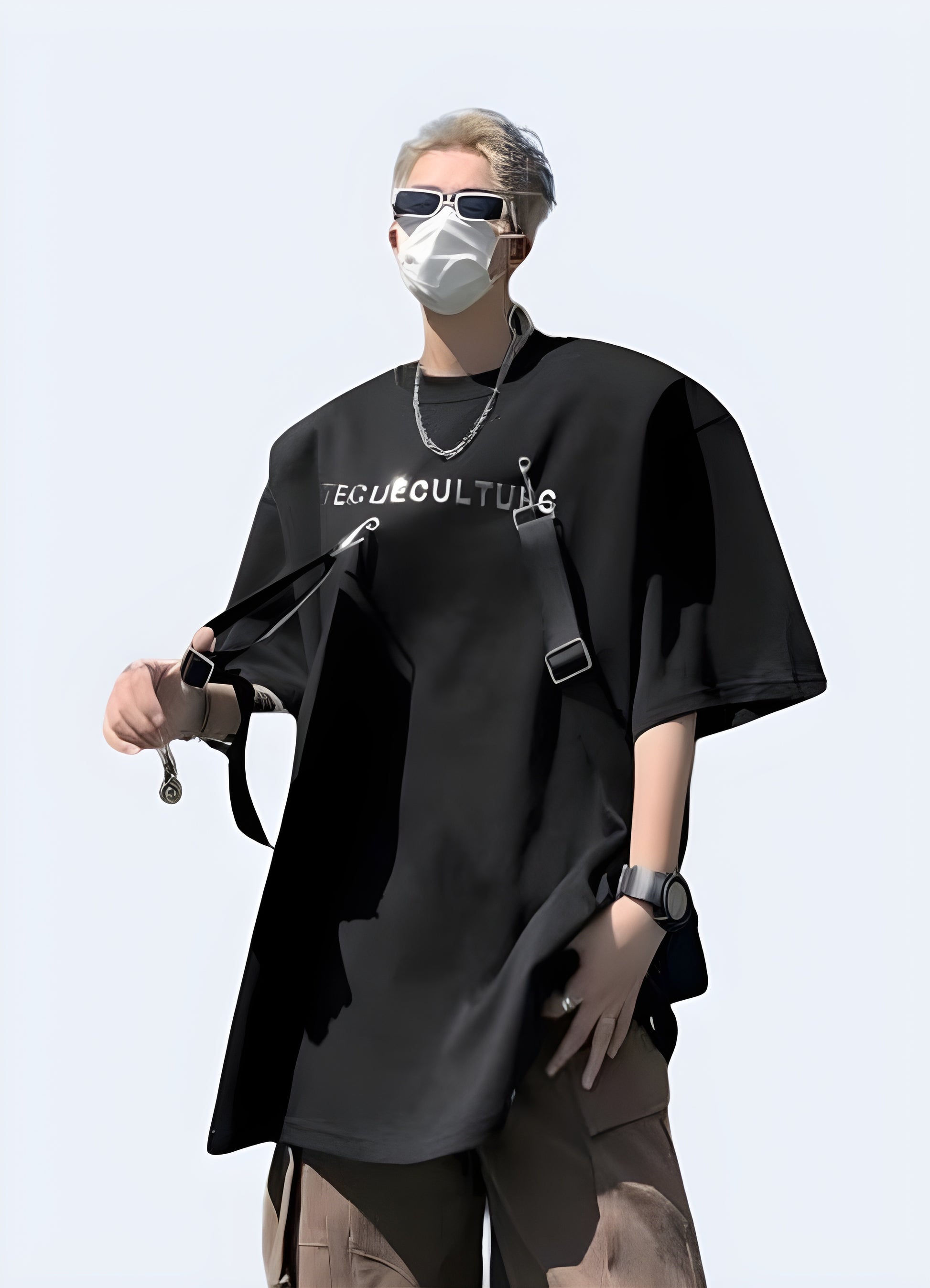 Its oversized design, painted in a rich noir, is accentuated by an arrangement of tactical straps. 