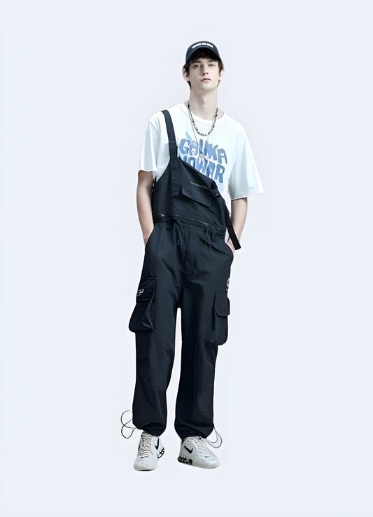 Front view of techwear overalls worn by model, featuring a modern utilitarian style with multiple pockets.